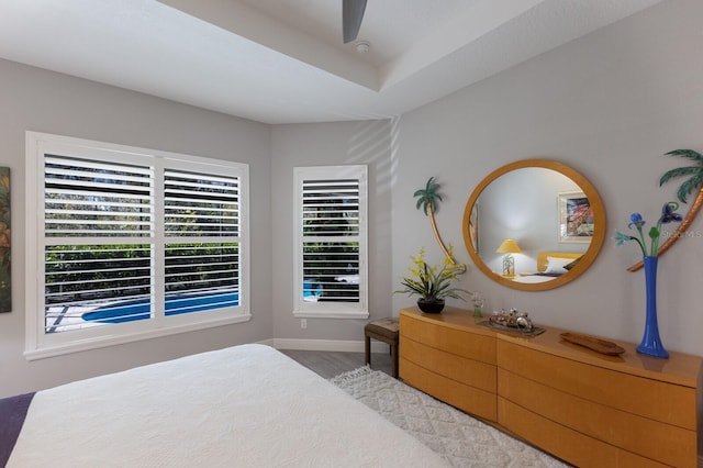 bedroom with ceiling fan and light hardwood / wood-style flooring