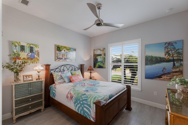 bedroom featuring hardwood / wood-style floors and ceiling fan