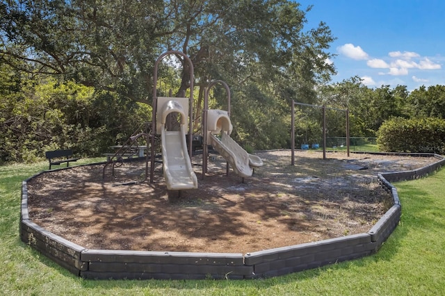 view of jungle gym with a lawn