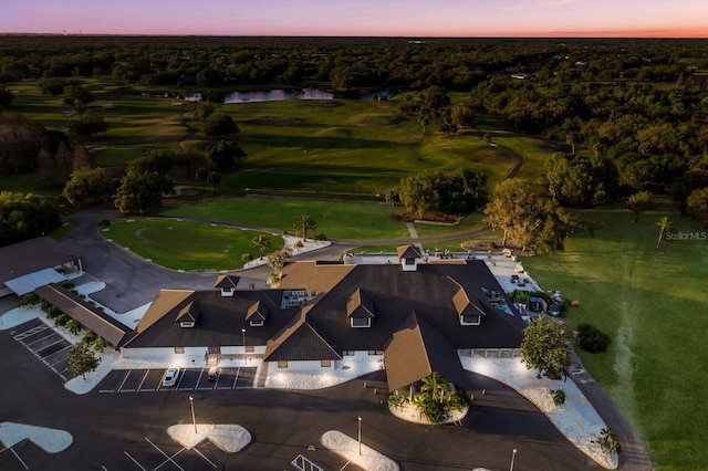 aerial view at dusk with a water view