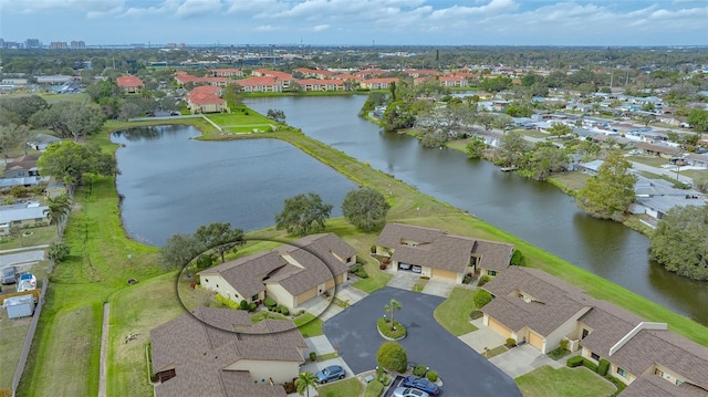 birds eye view of property with a residential view and a water view