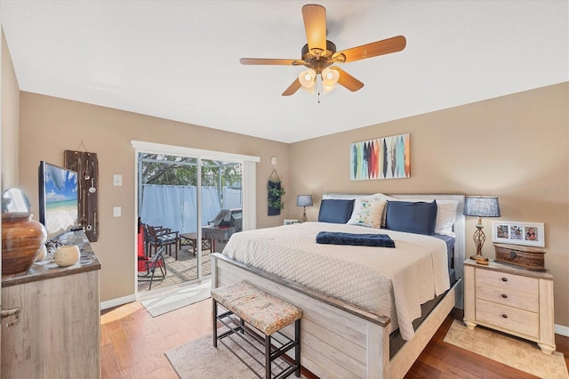 bedroom featuring hardwood / wood-style floors, access to outside, and ceiling fan