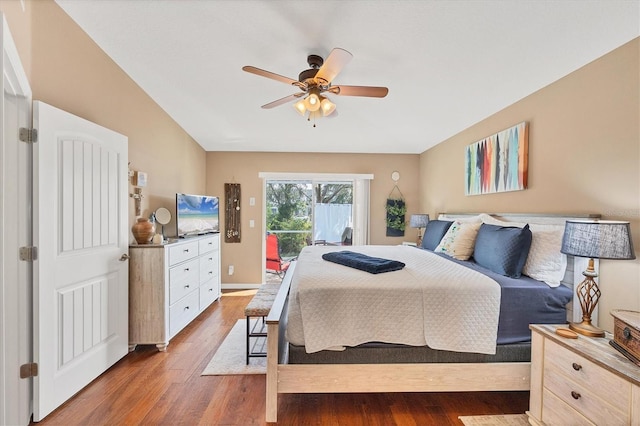 bedroom with access to outside, dark hardwood / wood-style floors, and ceiling fan