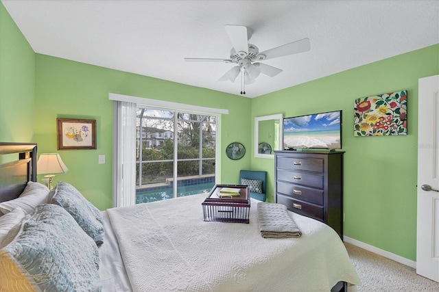 carpeted bedroom featuring ceiling fan and access to exterior