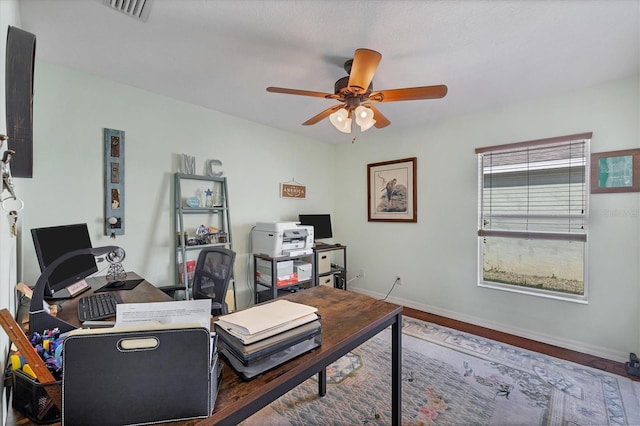 office area featuring ceiling fan and dark hardwood / wood-style flooring