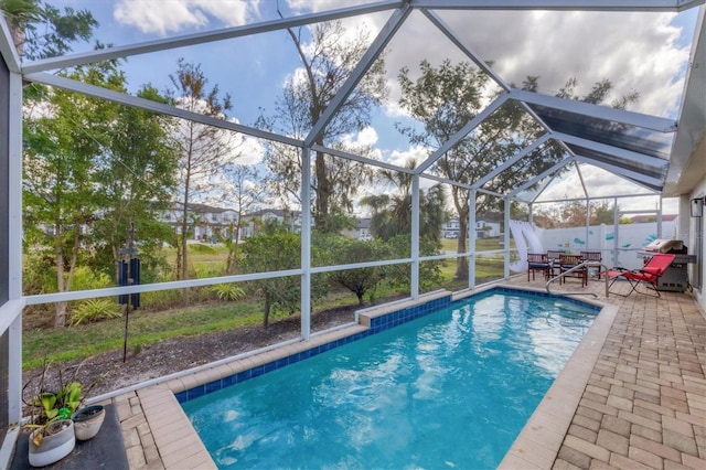 view of pool featuring a lanai and a patio area