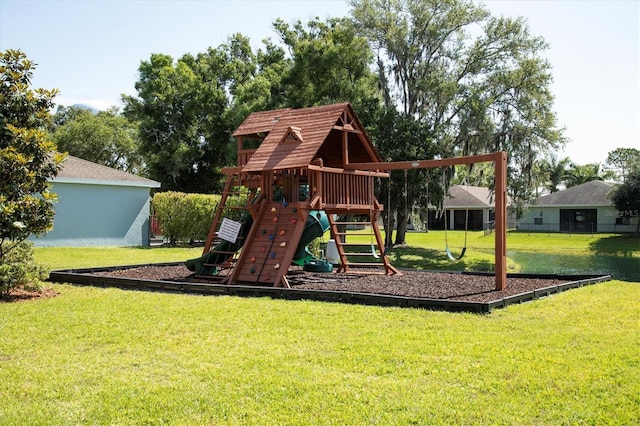 view of playground with a lawn