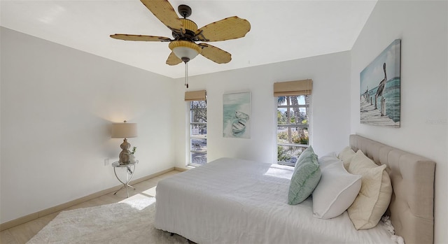 bedroom with ceiling fan and light hardwood / wood-style flooring