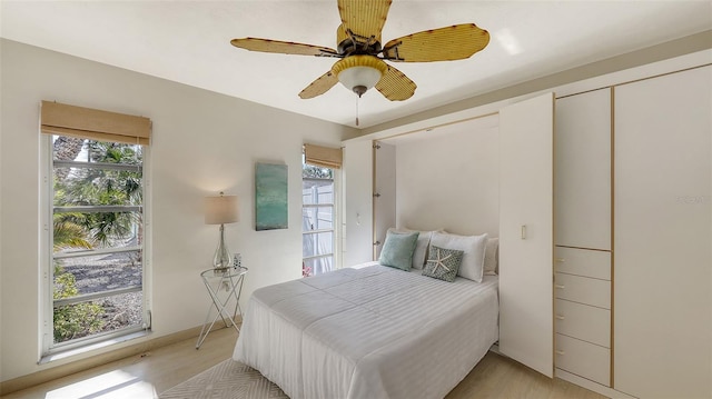 bedroom featuring ceiling fan and light hardwood / wood-style flooring