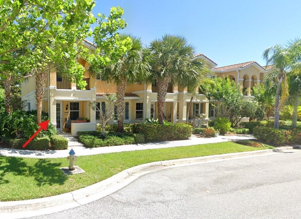 mediterranean / spanish-style house featuring a front lawn