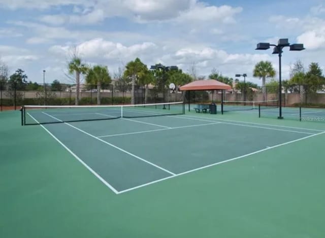 view of tennis court with a gazebo