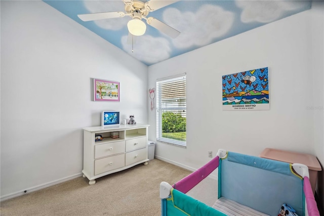 carpeted bedroom with lofted ceiling and ceiling fan