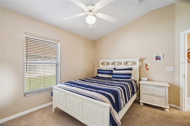 bedroom with ceiling fan, light colored carpet, and lofted ceiling