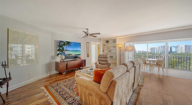 living room with hardwood / wood-style floors and ceiling fan