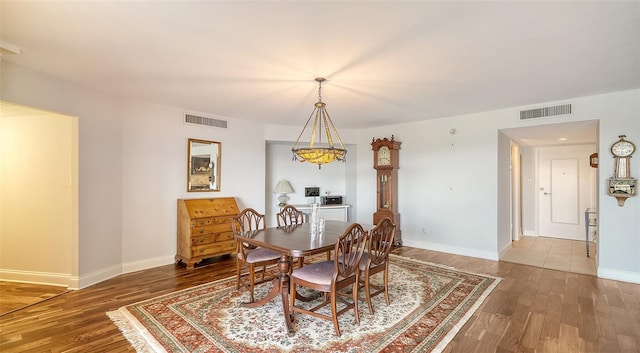 dining area featuring wood-type flooring