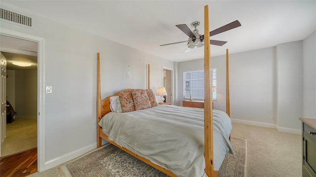 bedroom with ceiling fan and carpet flooring