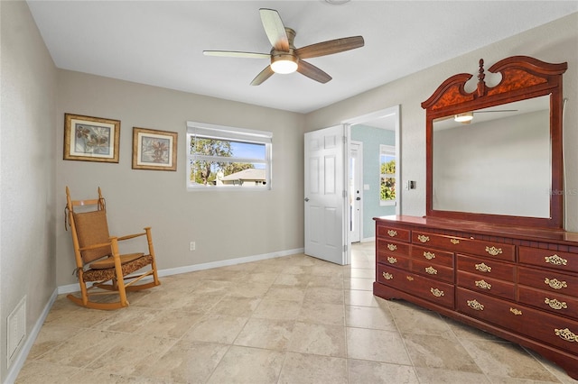 sitting room featuring ceiling fan and light tile patterned floors