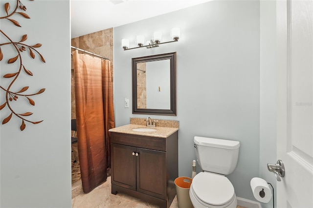 bathroom featuring toilet, a shower with shower curtain, and vanity
