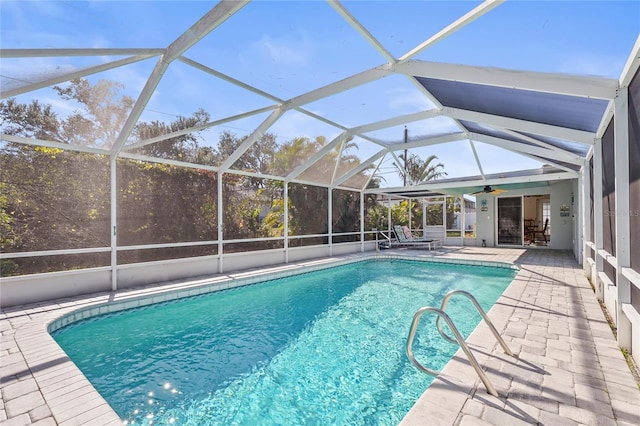pool featuring a patio area, a lanai, and ceiling fan