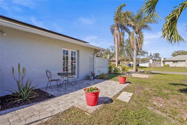 view of yard with french doors and a patio area