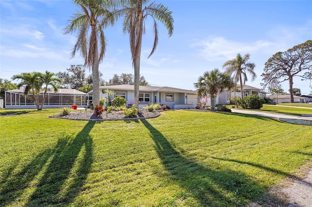 view of front of property featuring a front lawn and glass enclosure