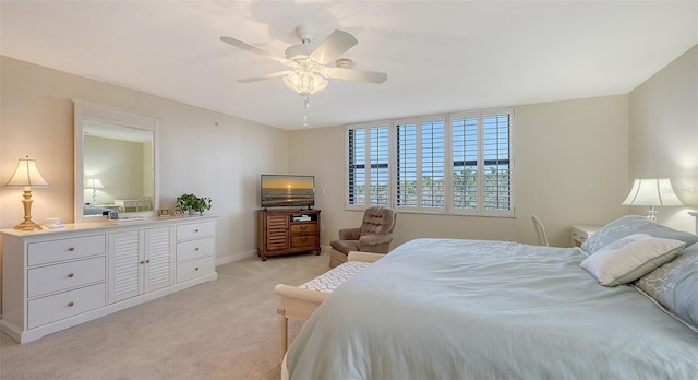 bedroom with light carpet and ceiling fan