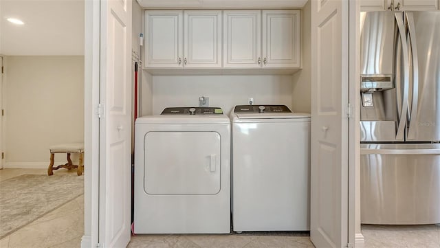 laundry area with cabinets and washer and dryer