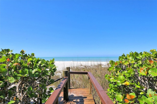 property view of water featuring a beach view