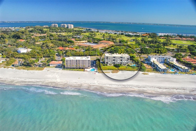 drone / aerial view featuring a view of the beach and a water view