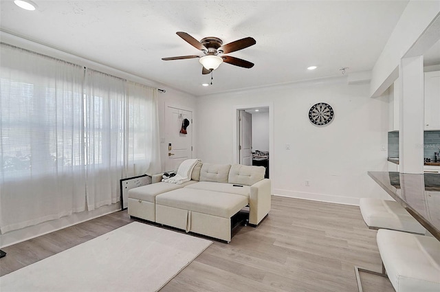 bedroom featuring ceiling fan and light hardwood / wood-style flooring