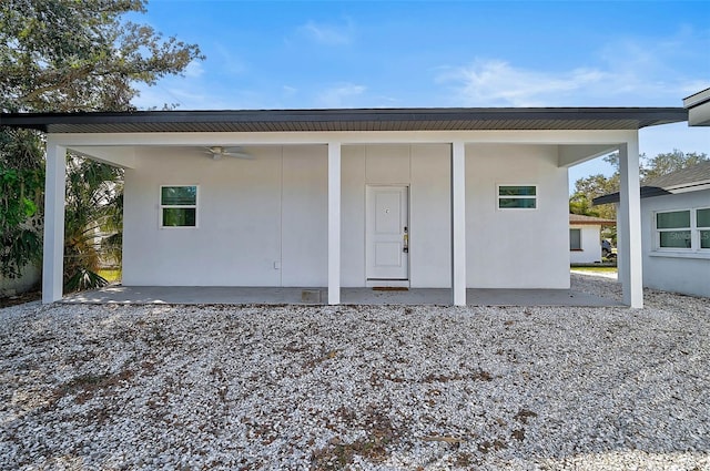 rear view of house with a patio area and ceiling fan