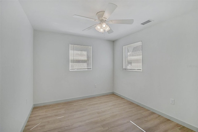 spare room featuring ceiling fan and light hardwood / wood-style floors