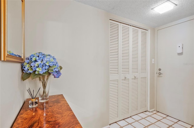 foyer with a textured ceiling