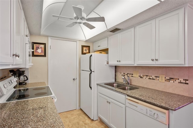 kitchen with visible vents, decorative backsplash, white cabinetry, a sink, and white appliances