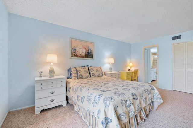 bedroom featuring light carpet, a closet, visible vents, and a textured ceiling