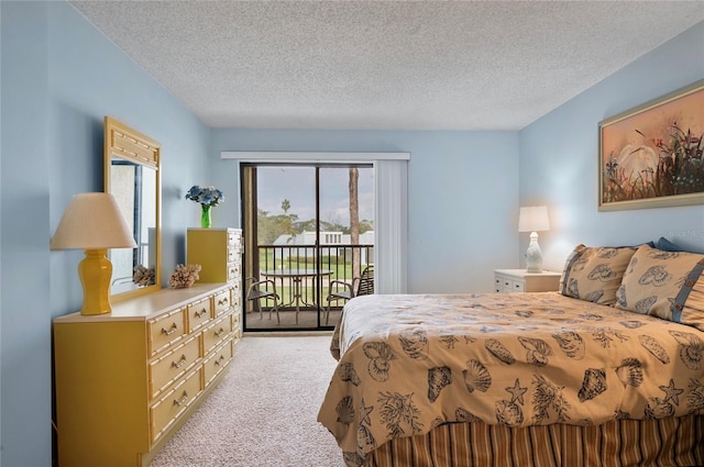 bedroom with light carpet, a textured ceiling, and access to exterior