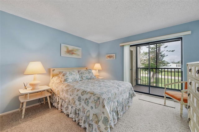 bedroom featuring a textured ceiling, carpet, baseboards, and access to exterior