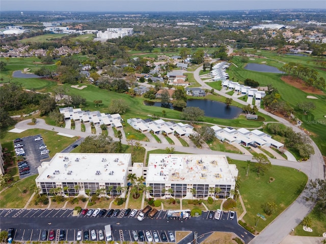 bird's eye view featuring view of golf course and a water view