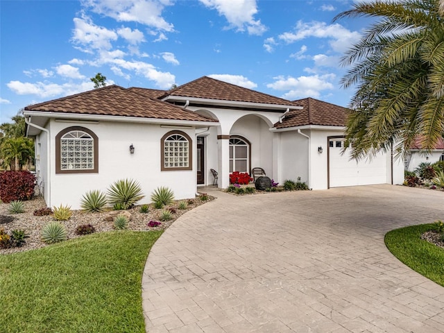 mediterranean / spanish-style house featuring a garage