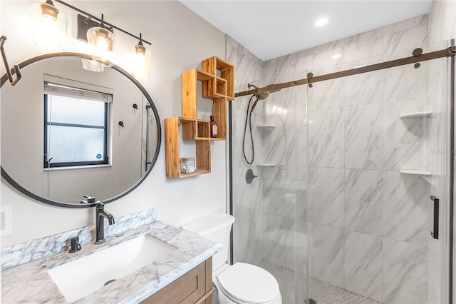 bathroom with vanity, toilet, and walk in shower