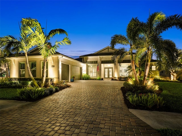 view of front facade featuring a garage and french doors