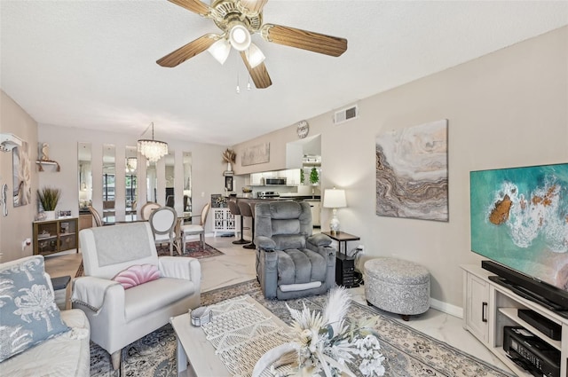 1515 Forrest Nelson Blvd Unit Q205, Port Charlotte, FL 33952 - living area with marble finish floor, ceiling fan with notable chandelier, baseboards, and visible vents