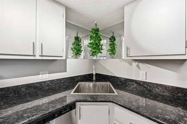 1515 Forrest Nelson Blvd Unit Q205, Port Charlotte, FL 33952 - kitchen featuring a textured ceiling, white cabinets, dark stone countertops, a sink, and stainless steel dishwasher