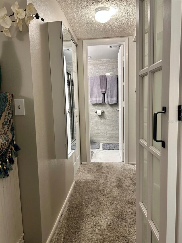 1515 Forrest Nelson Blvd Unit Q205, Port Charlotte, FL 33952 - hallway with carpet flooring and a textured ceiling