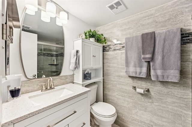 1515 Forrest Nelson Blvd Unit Q205, Port Charlotte, FL 33952 - full bathroom featuring vanity, visible vents, toilet, and a shower stall
