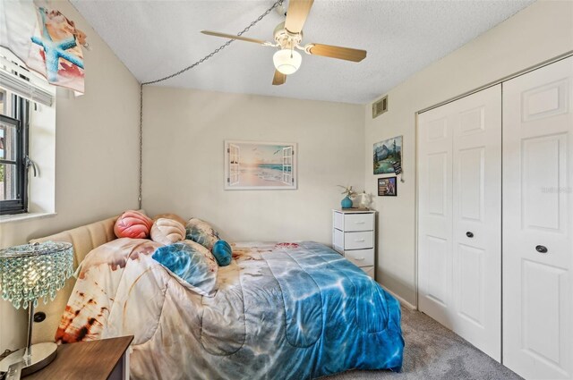1515 Forrest Nelson Blvd Unit Q205, Port Charlotte, FL 33952 - bedroom with a closet, carpet flooring, a textured ceiling, visible vents, and a ceiling fan