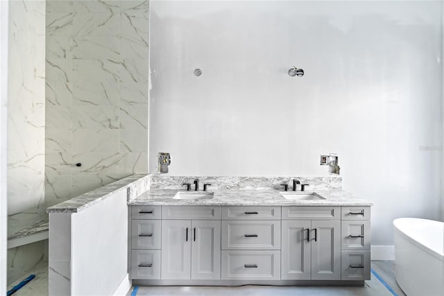 bathroom with vanity and a bathtub