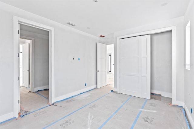 unfurnished bedroom featuring a closet