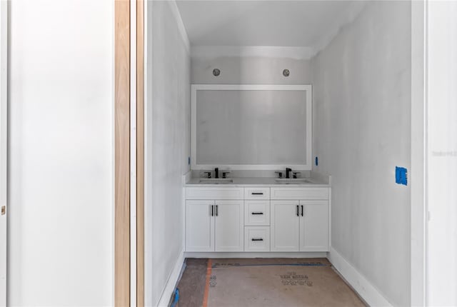 bathroom with concrete flooring and vanity