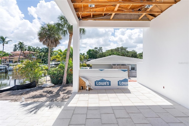 view of patio with a water view